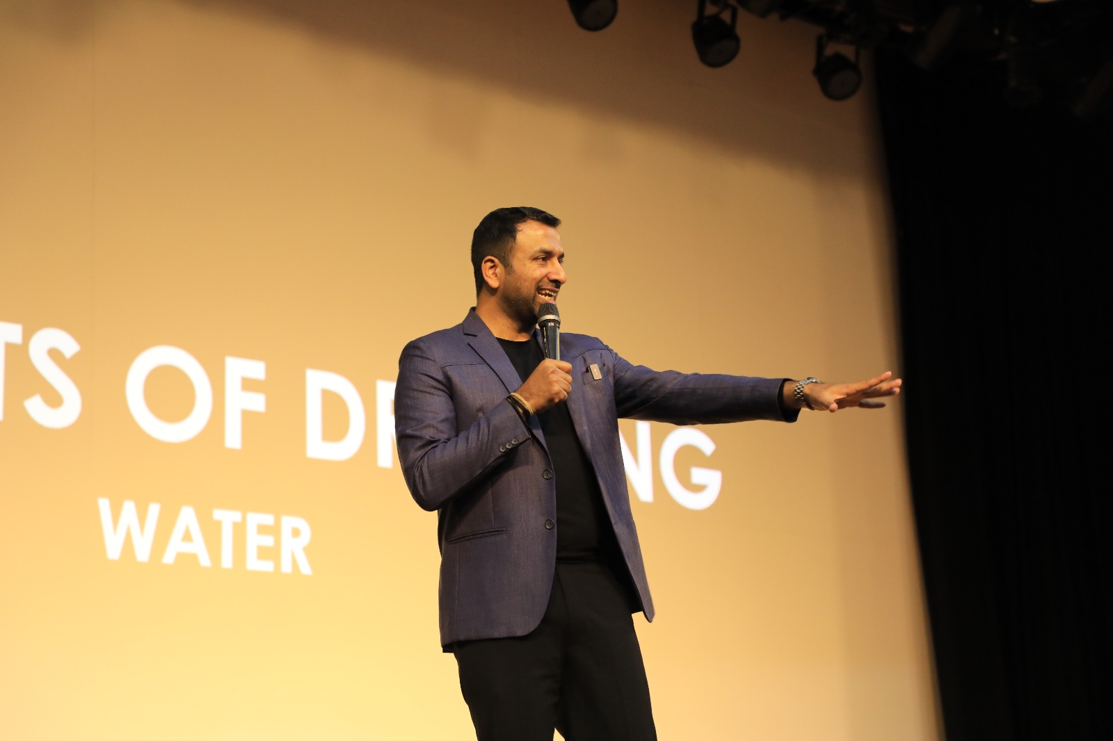 Saveen Hegde presenting on stage