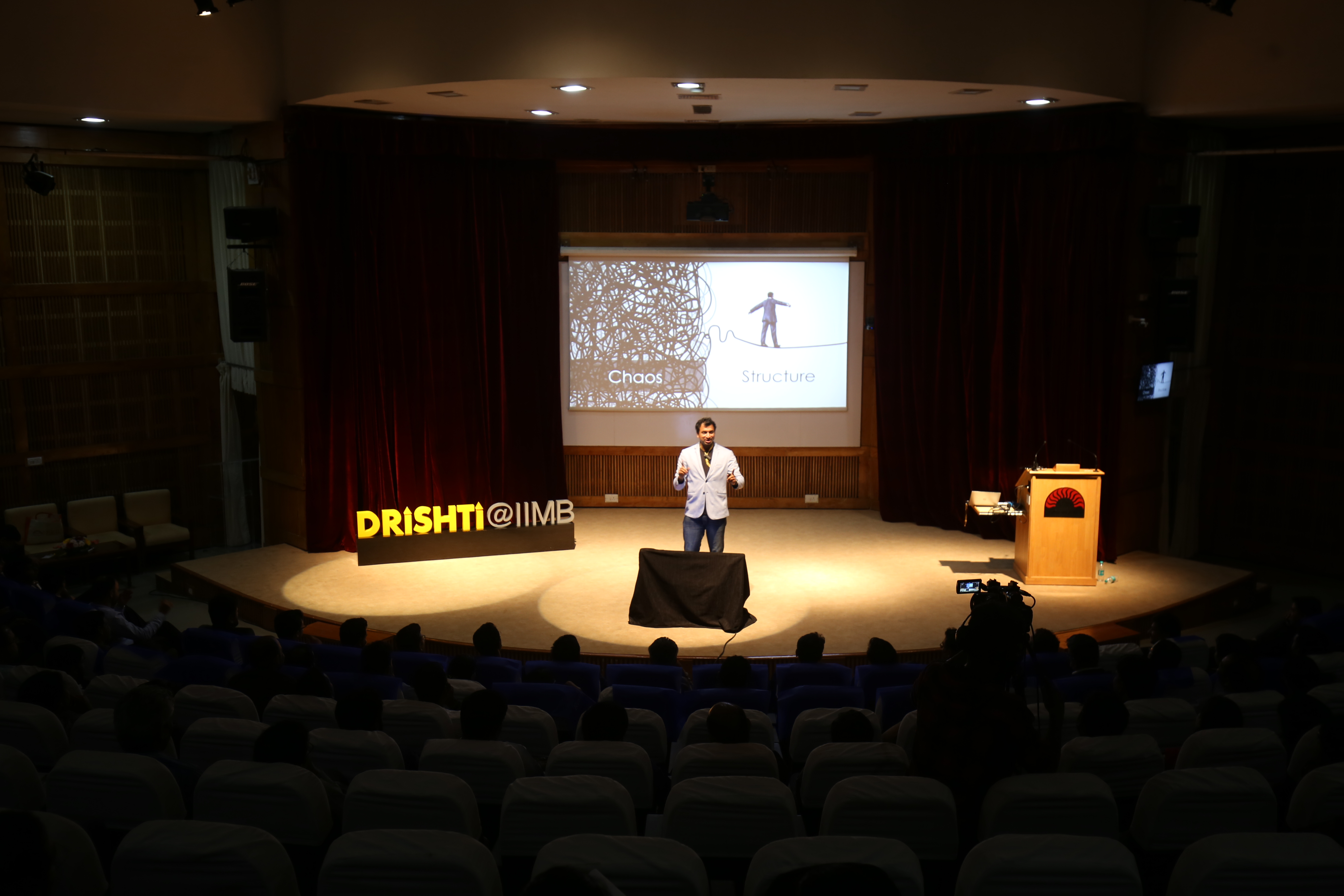 Saveen Hegde presenting on stage